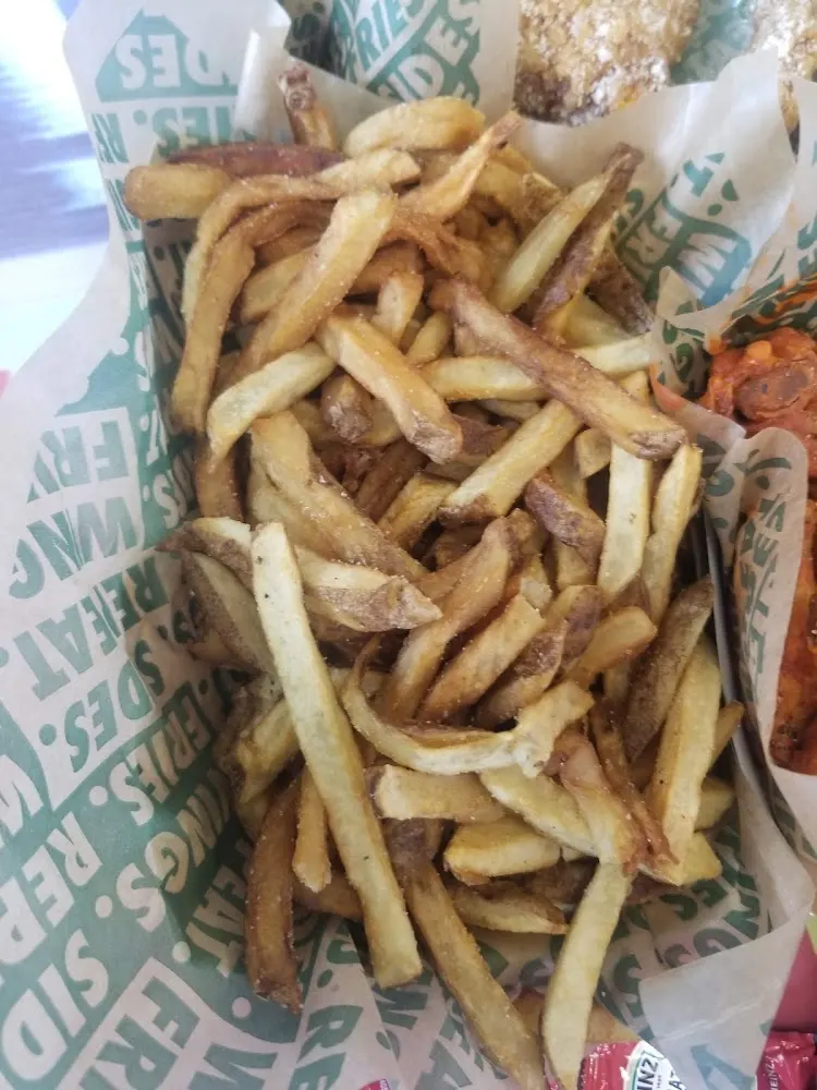 Wingstop food and storefront view at 5621 Beechnut St Ste A in Houston, Texas