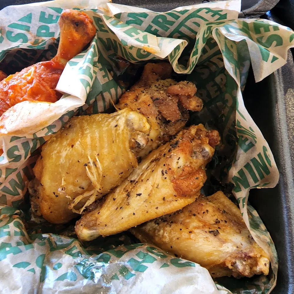 Wingstop food and storefront view at 448D W LITTLE YORK RD in Houston, Texas