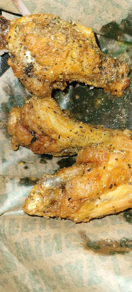 Wingstop food and storefront view at 10001  Westheimer Rd Suite 2525 in Houston, Texas