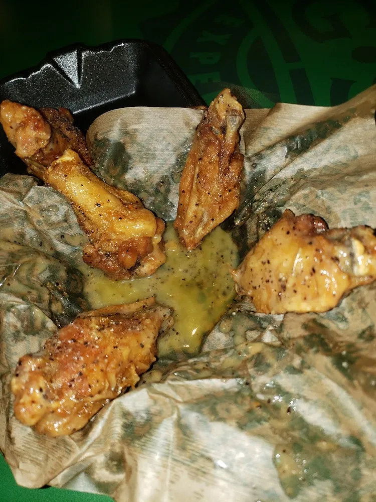 Wingstop food and storefront view at 3500 Little York Rd in Houston, Texas