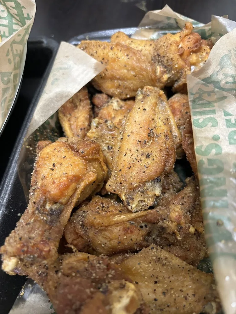Wingstop food and storefront view at 2319 S Kirkwood Rd in Houston, Texas