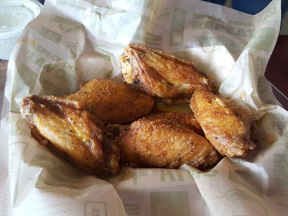 Wingstop food and storefront view at 7332 Antoine in Houston, Texas