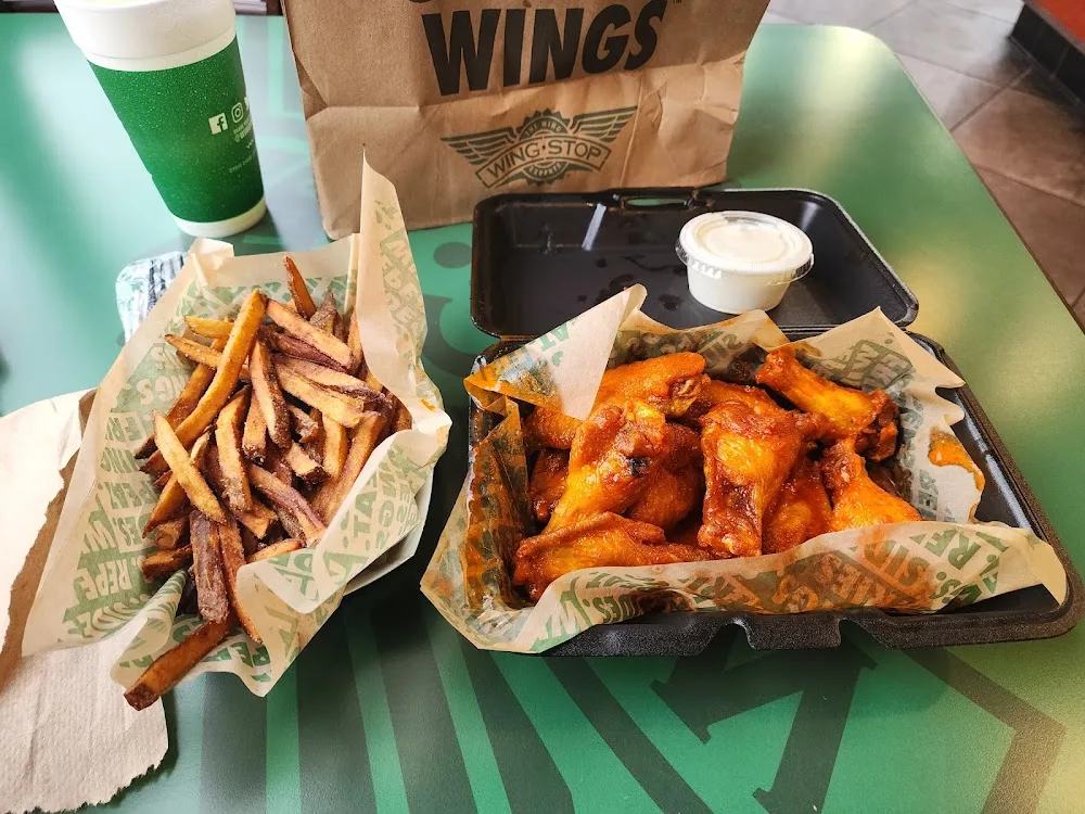 Wingstop food and storefront view at 5185 W 34th Street in Houston, Texas