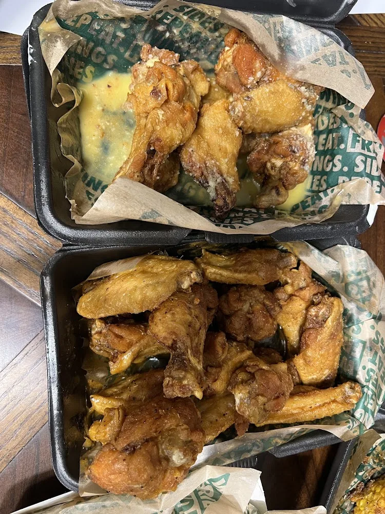 Wingstop food and storefront view at 15242 Wallisville Rd in Houston, Texas