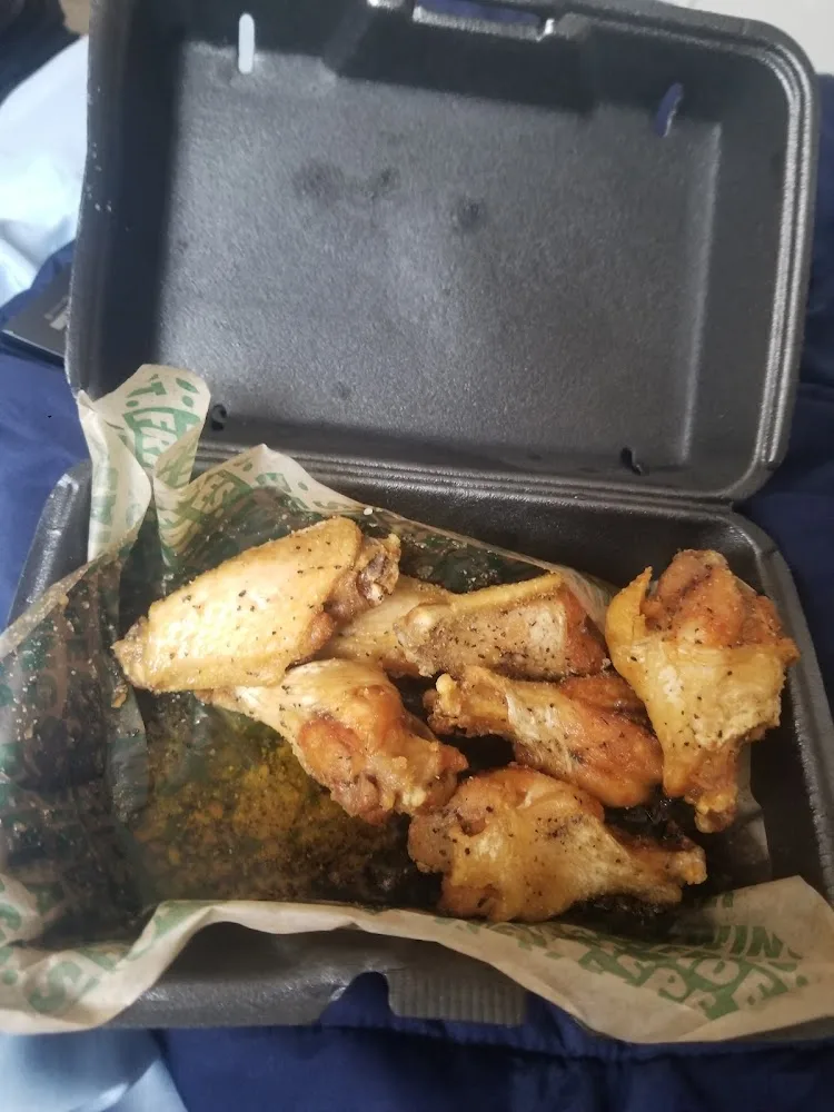 Wingstop food and storefront view at 8540 Highway 6 N in Houston, Texas