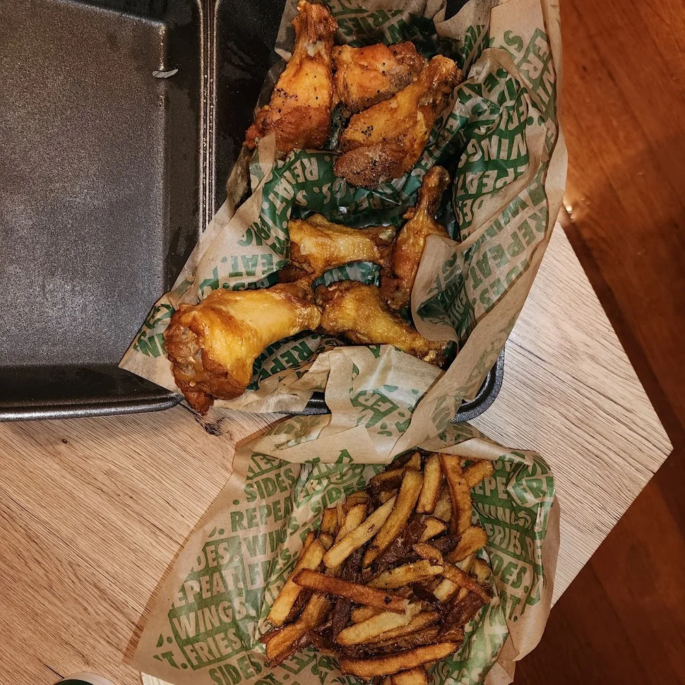 Wingstop food and storefront view at 174 Yale St Ste 600 in Houston, Texas