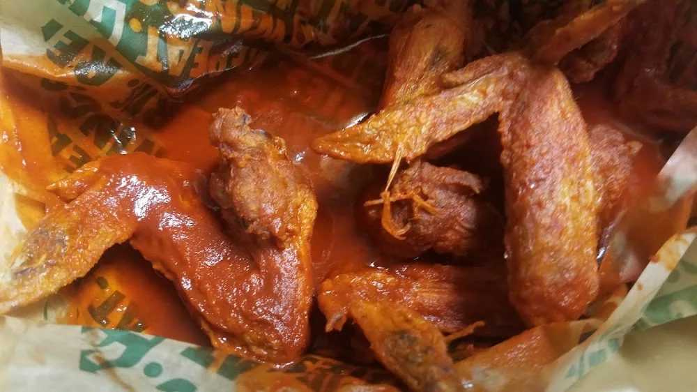 Wingstop food and storefront view at 1167 Edgebrook Dr in Houston, Texas