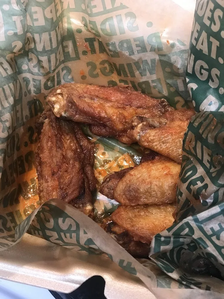 Wingstop food and storefront view at 11936 Bellaire Blvd in Houston, Texas
