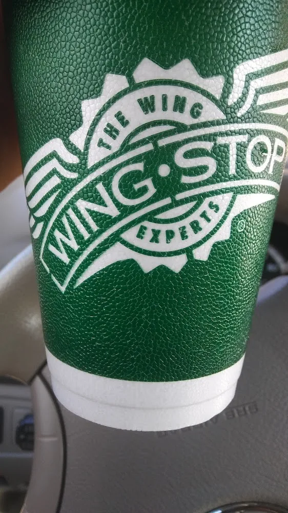 Wingstop food and storefront view at 128 1St St W in Humble, Texas