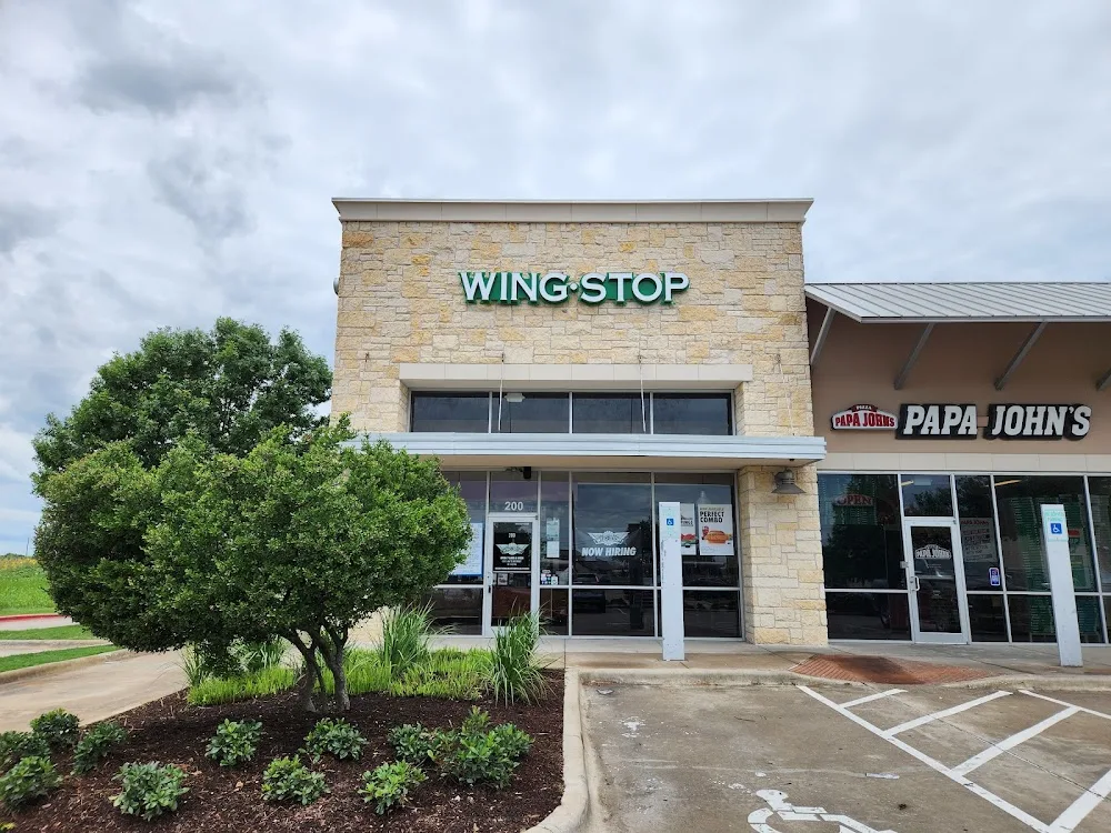 Wingstop food and storefront view at 125 Ed Schmidt Blvd in Hutto, Texas
