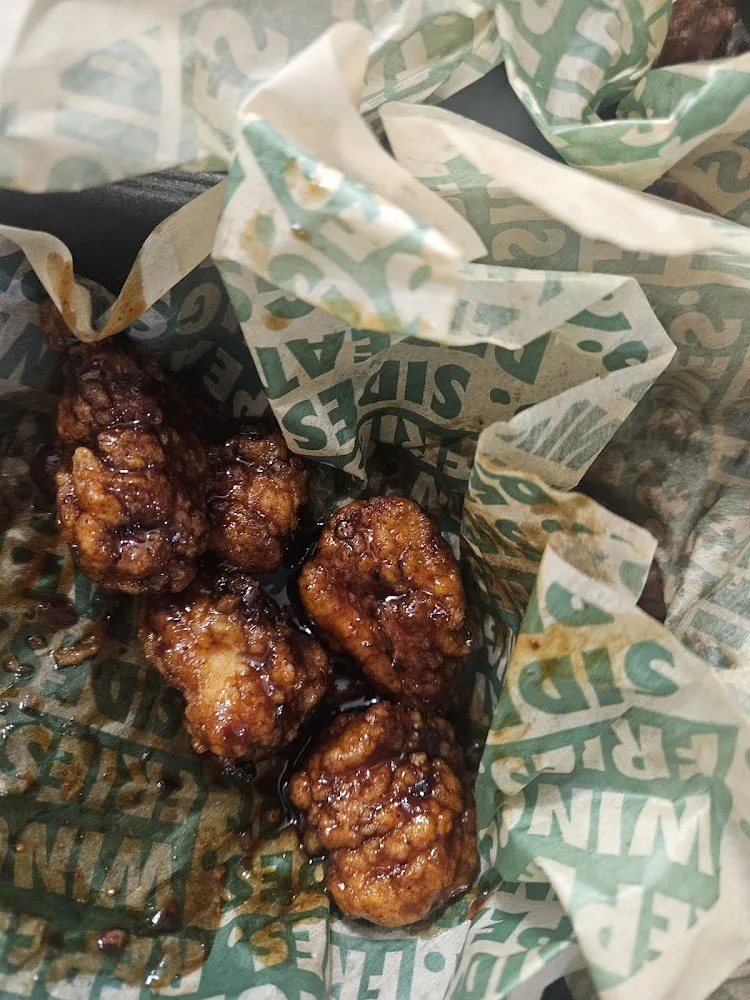 Wingstop food and storefront view at 10009 N Macarthur Blvd Ste 117 in Irving, Texas