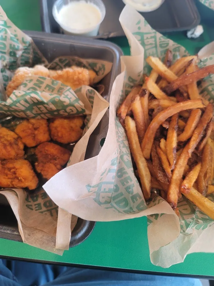 Wingstop food and storefront view at 11410 East Frwy #200 in Jacinto City, Texas