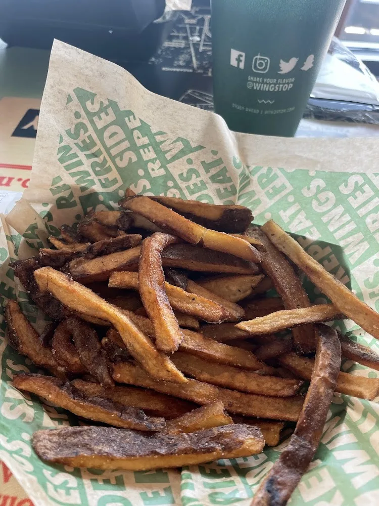 Wingstop food and storefront view at 9550 Spring Green Blvd Ste 414 in Katy, Texas