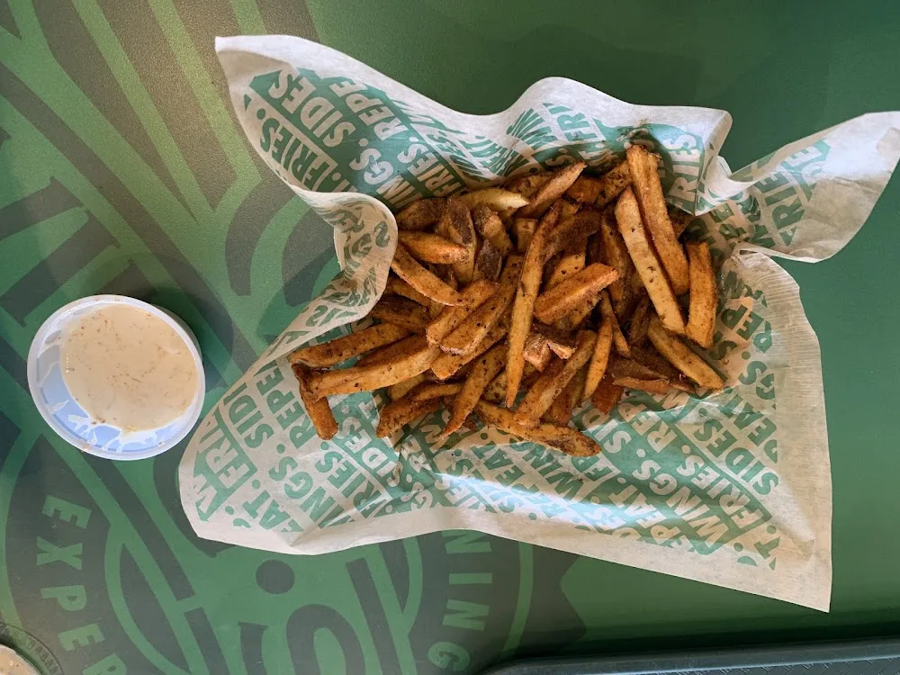 Wingstop food and storefront view at 1304 Junction Highway STE 550 in Kerrville, Texas