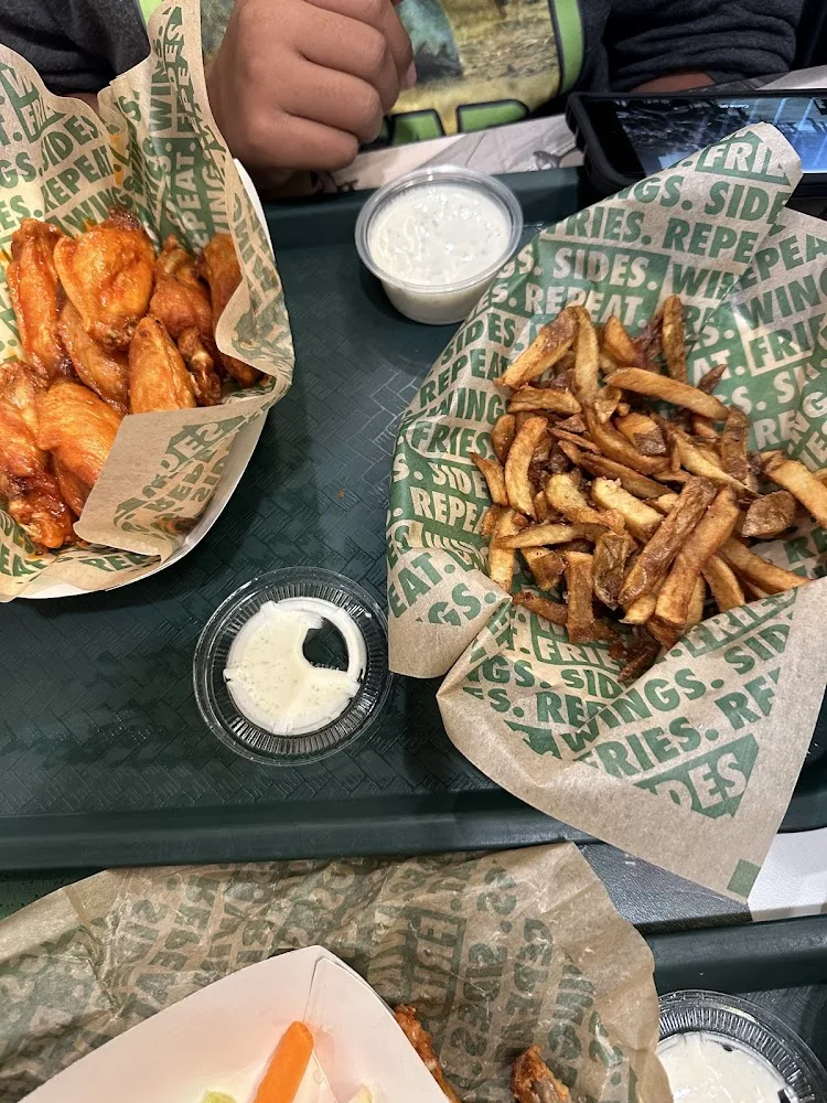 Wingstop food and storefront view at 117 TX-332 W in Lake Jackson, Texas