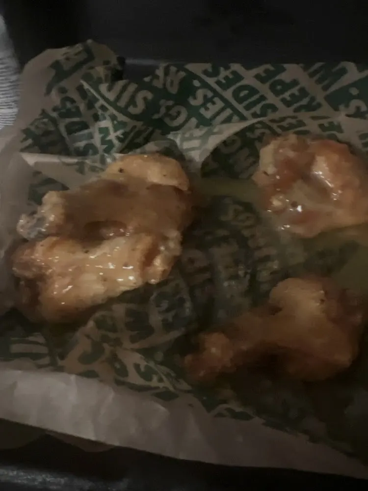 Wingstop food and storefront view at 1510 RM 620 in Lakeway, Texas