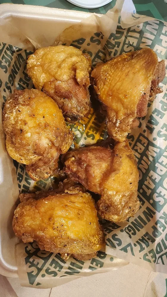 Wingstop food and storefront view at 1438 W. Fairmont Parkway in La Porte, Texas