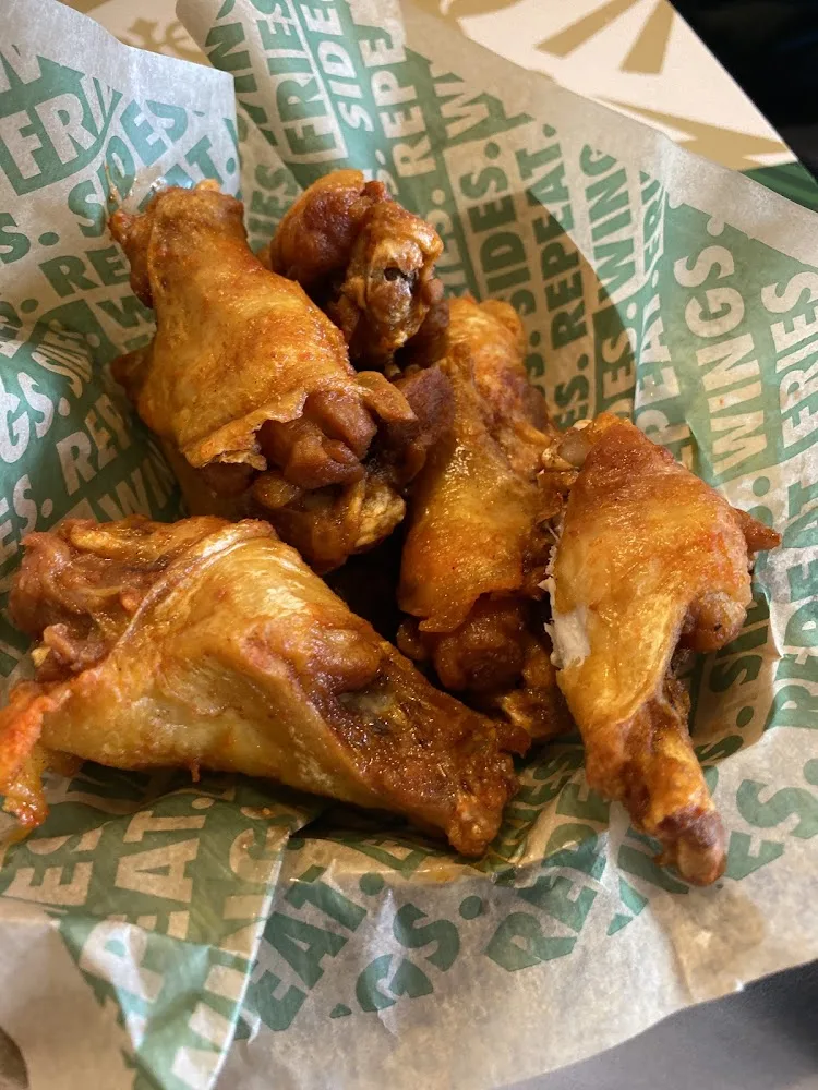 Wingstop food and storefront view at 4415 US Hwy 83 S Ste 300 in Laredo, Texas
