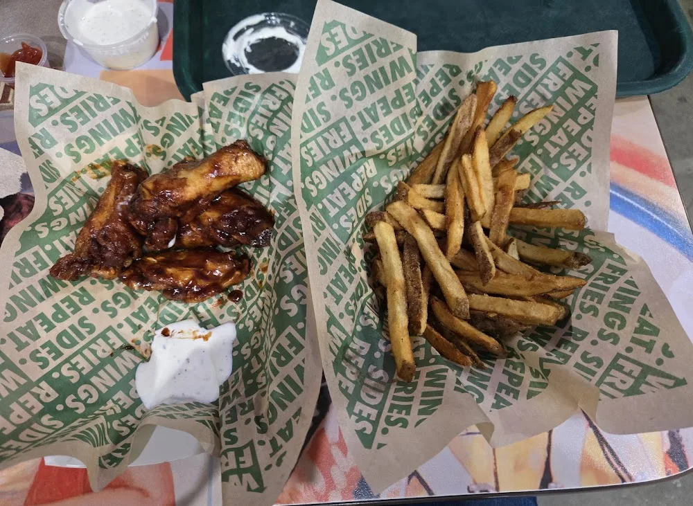 Wingstop food and storefront view at 7309 San Dario Ave Ste 150 in Laredo, Texas