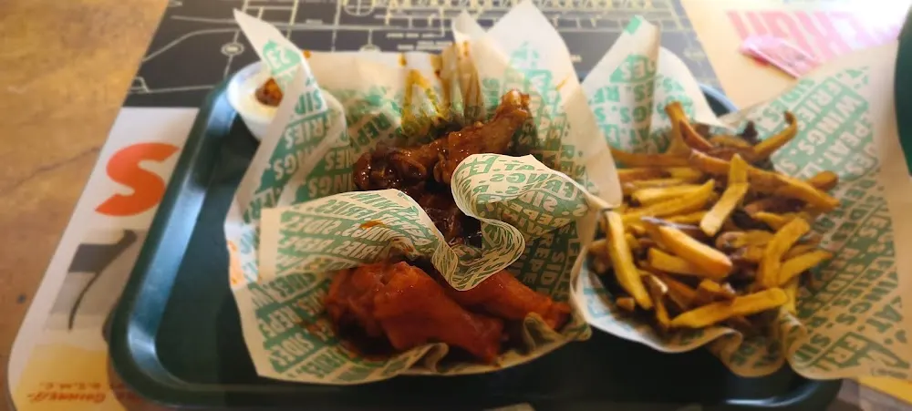 Wingstop food and storefront view at 405 E Ocean Blvd in Los Fresnos, Texas