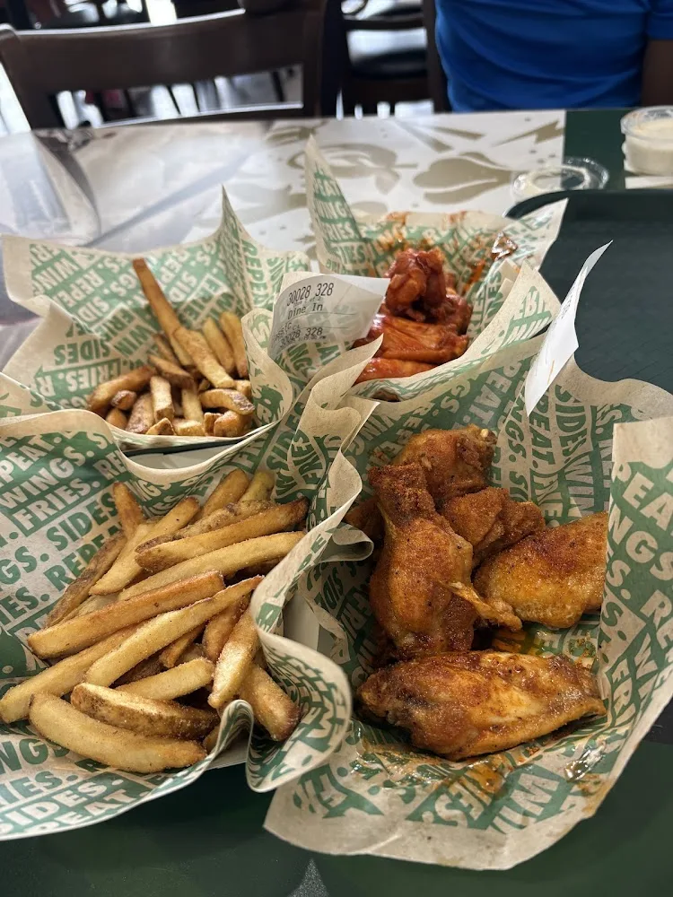 Wingstop food and storefront view at 518 E Loop 281 in Longview, Texas