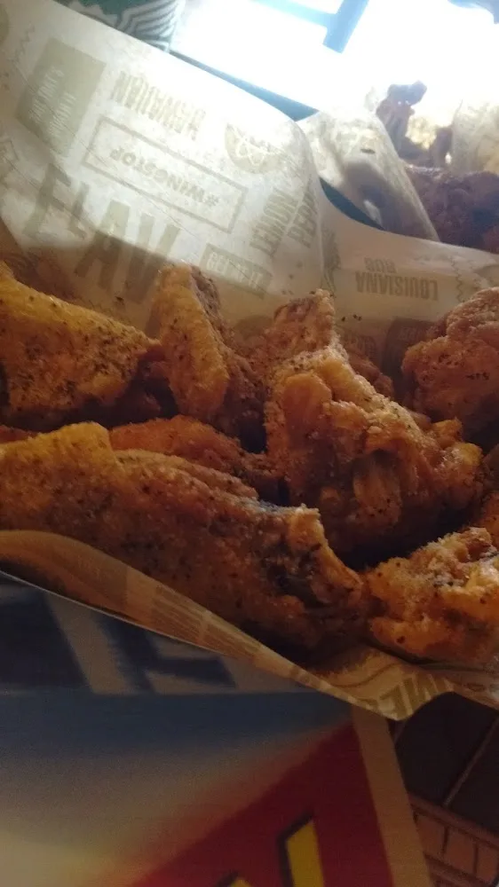 Wingstop food and storefront view at 5510 4Th St Ste 220 in Lubbock, Texas
