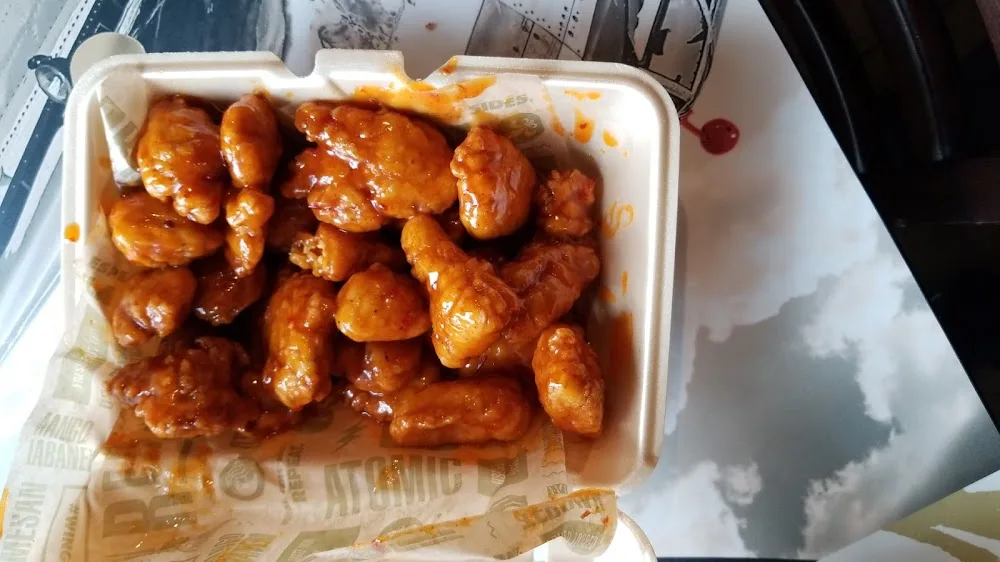 Wingstop food and storefront view at 2210 East Broad Street in Mansfield, Texas