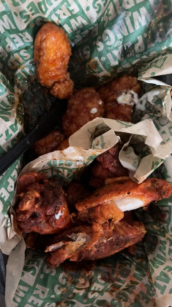 Wingstop food and storefront view at 1681 N Central Expy Ste 100 in Mckinney, Texas