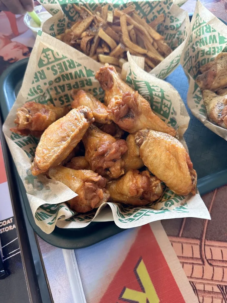 Wingstop food and storefront view at 210 W Longview Ave Ste C in Midland, Texas