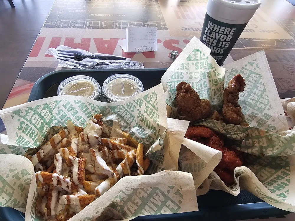 Wingstop food and storefront view at 3323 N Midland Dr Ste 105 in Midland, Texas