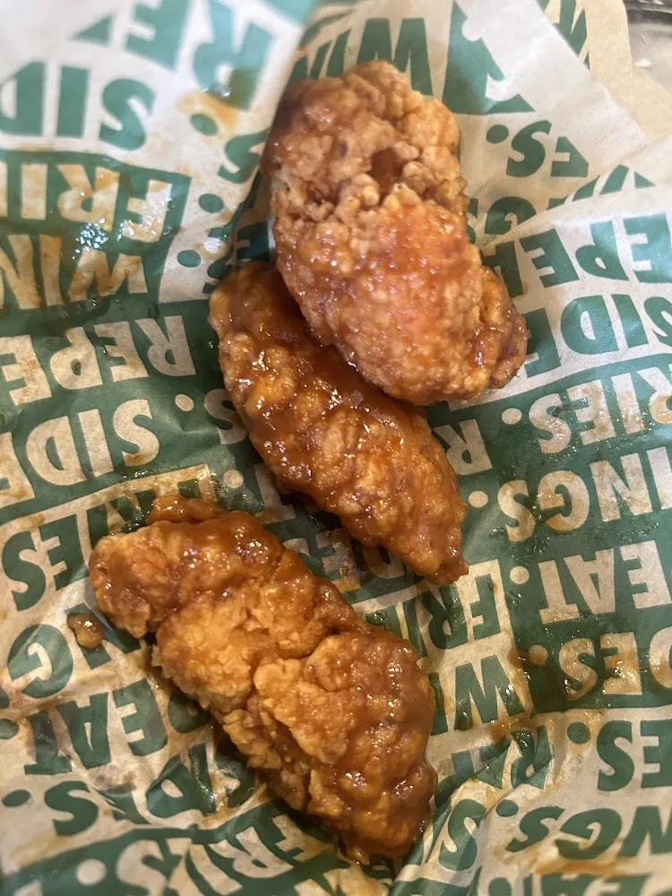 Wingstop food and storefront view at 1801 N Conway Ave Ste F in Mission, Texas