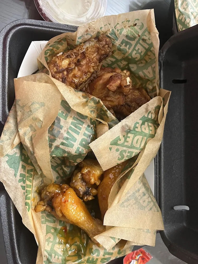 Wingstop food and storefront view at 2240 Texas Pkwy Ste 100 in Missouri City, Texas