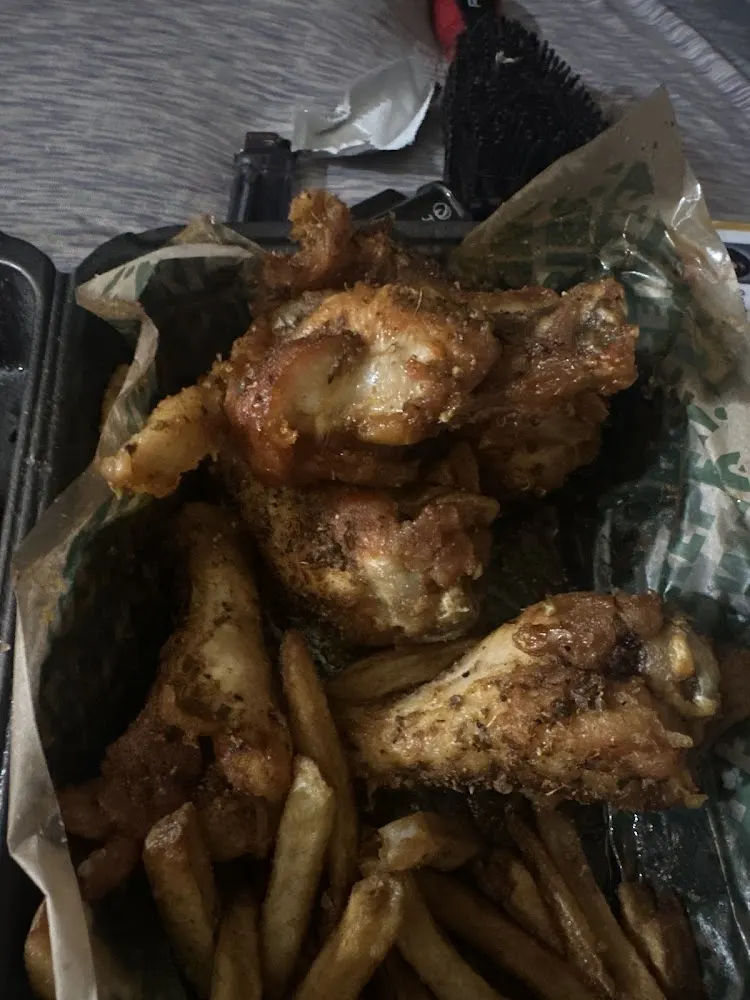 Wingstop food and storefront view at 4909 North St Ste 206 in Nacogdoches, Texas