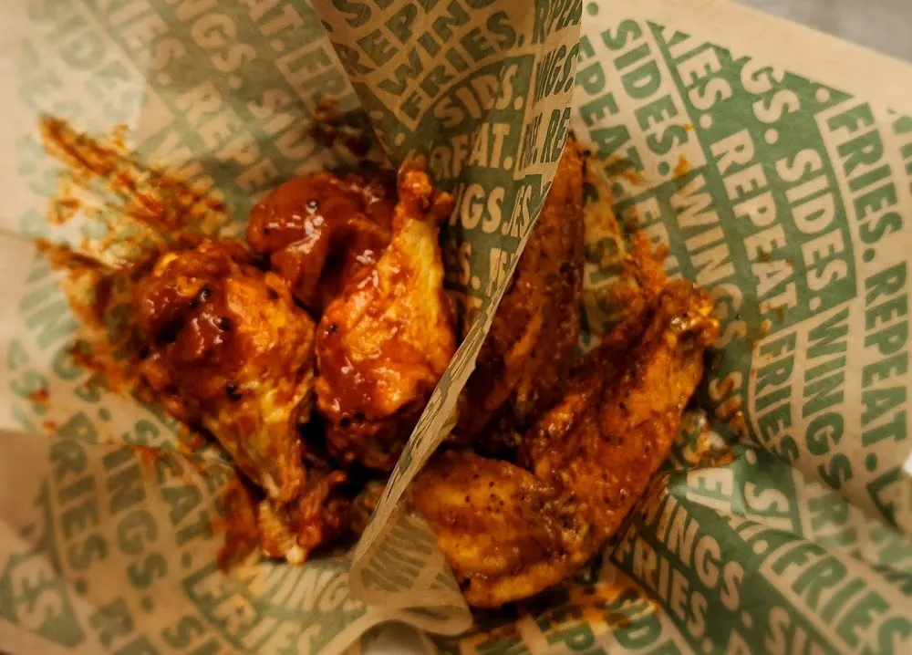 Wingstop food and storefront view at 8412 Davis Blvd in North Richland Hills, Texas