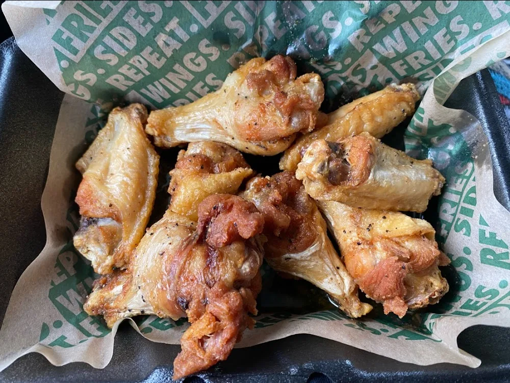 Wingstop food and storefront view at 5000 State Highway 114 in Northlake, Texas