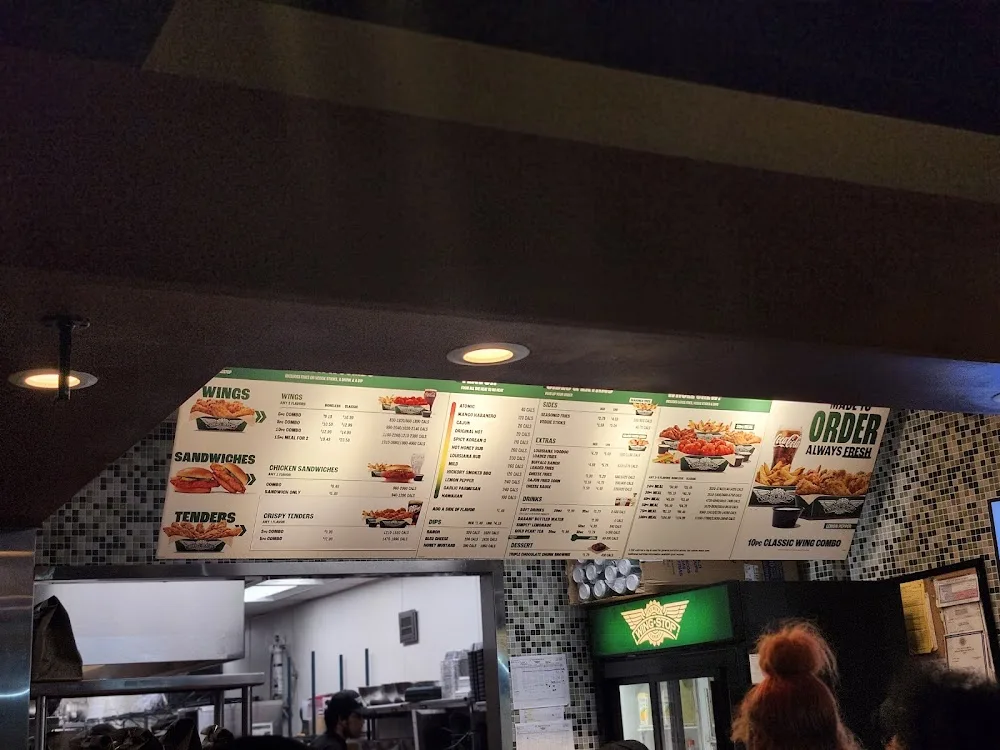 Wingstop food and storefront view at 3437 Spencer Hwy in Pasadena, Texas