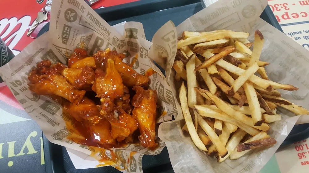 Wingstop food and storefront view at 1625-A S. Loop 256 in Palestine, Texas