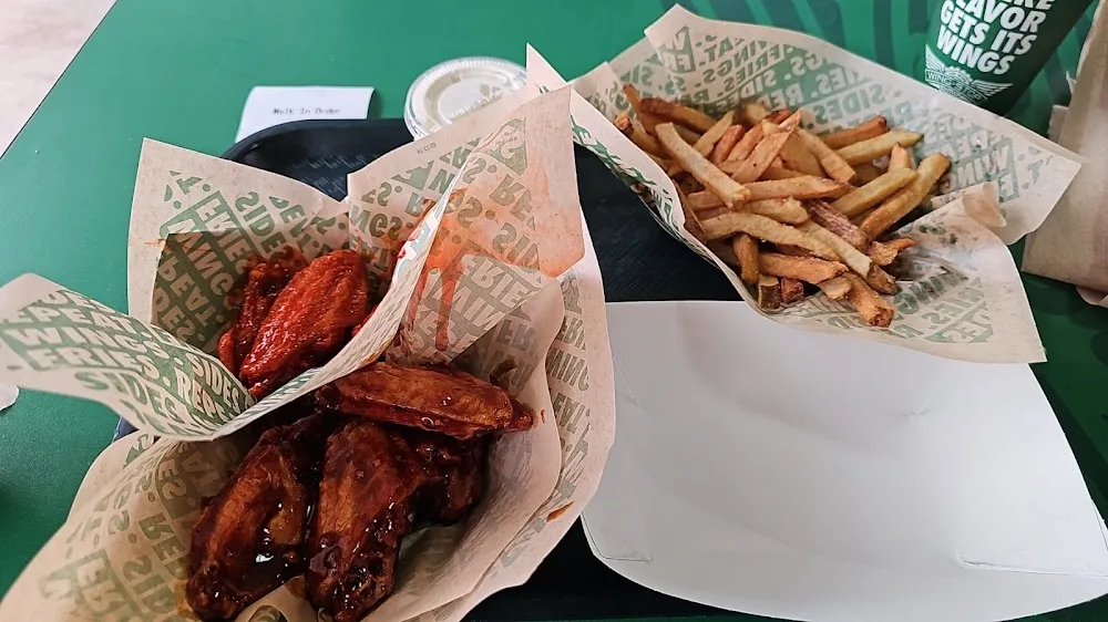 Wingstop food and storefront view at 222 E. Mile 3 Rd STE 120 in Palmhurst, Texas