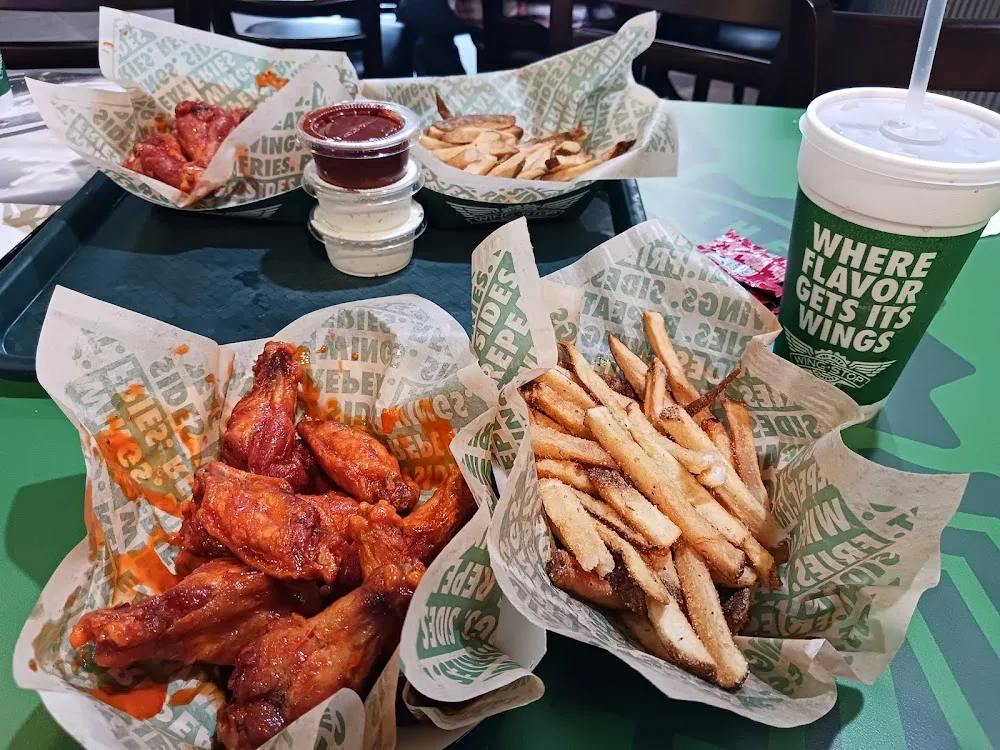 Wingstop food and storefront view at 7730 Spencer Highway in Pasadena, Texas