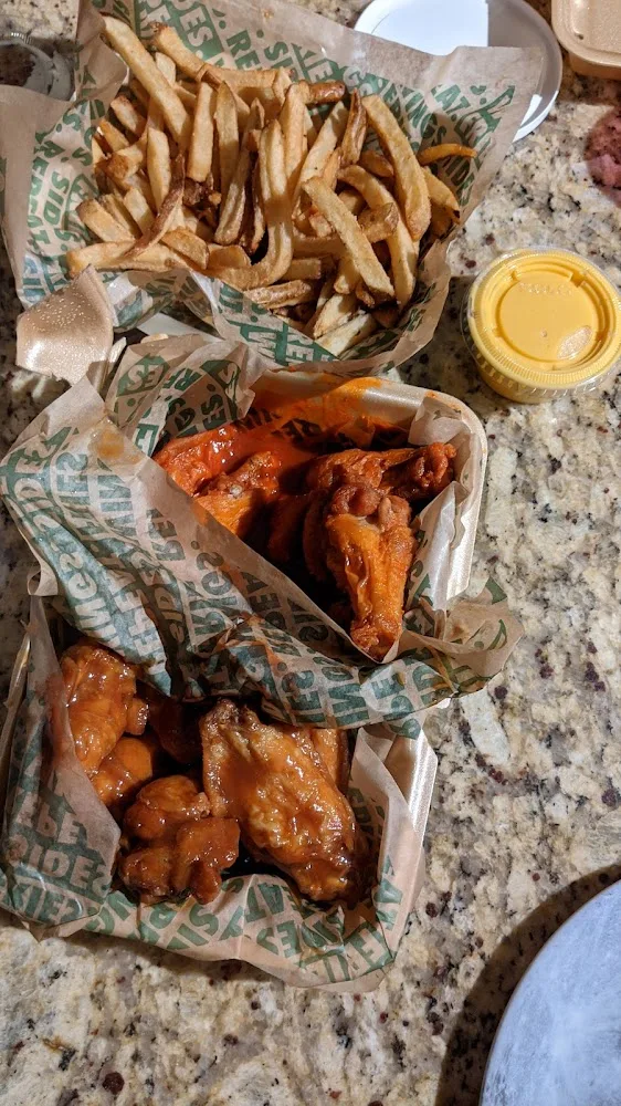 Wingstop food and storefront view at 1709 E Expy 83 in Penitas, Texas