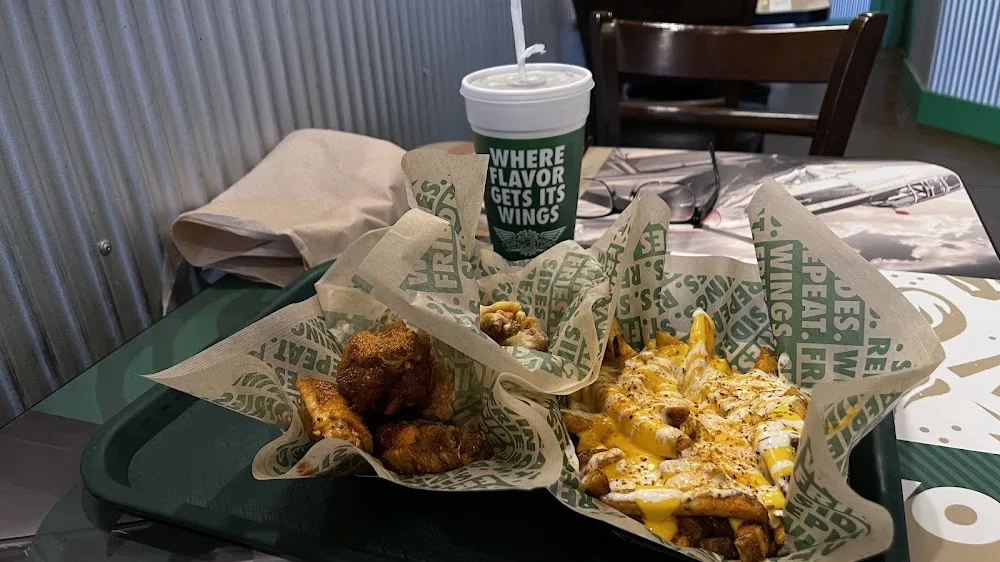 Wingstop food and storefront view at 2503 S. Cedar Street 102 in Pecos, Texas