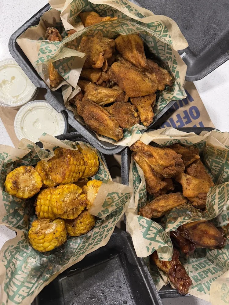 Wingstop food and storefront view at 2100 14th St Ste 119 in Plano, Texas