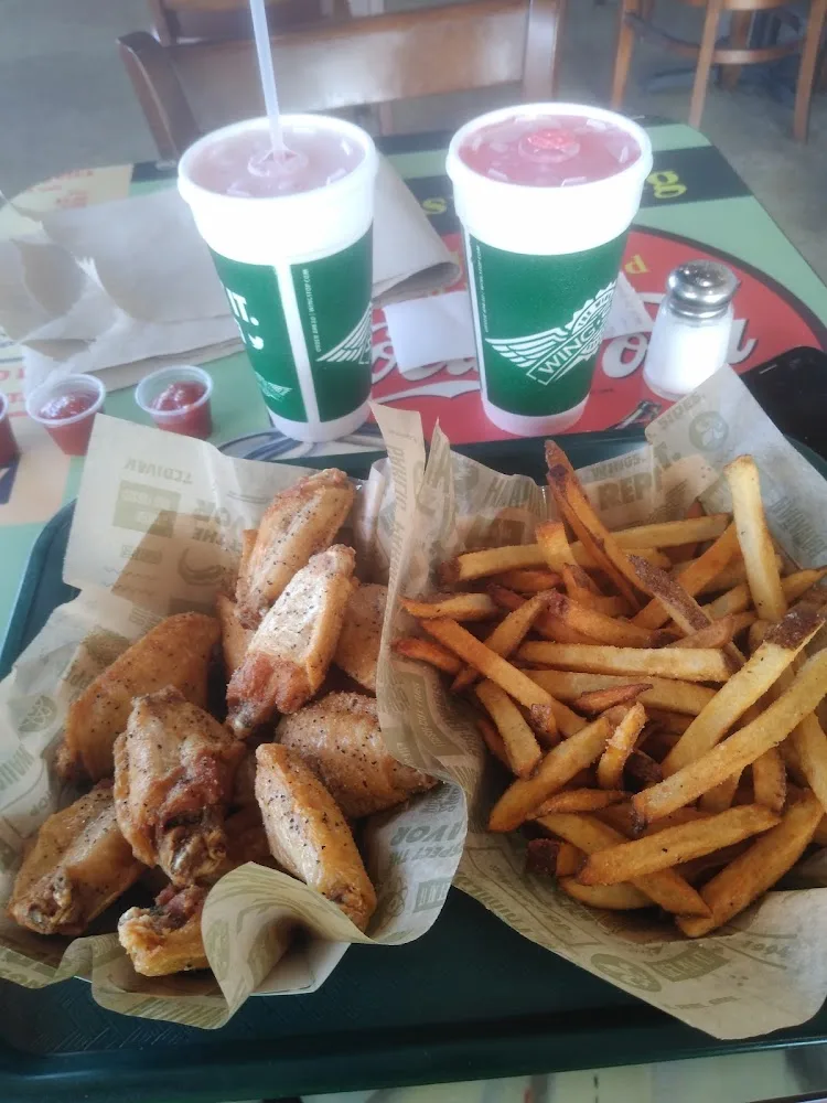 Wingstop food and storefront view at 2044 W Oaklawn Rd Ste 130 in Pleasanton, Texas