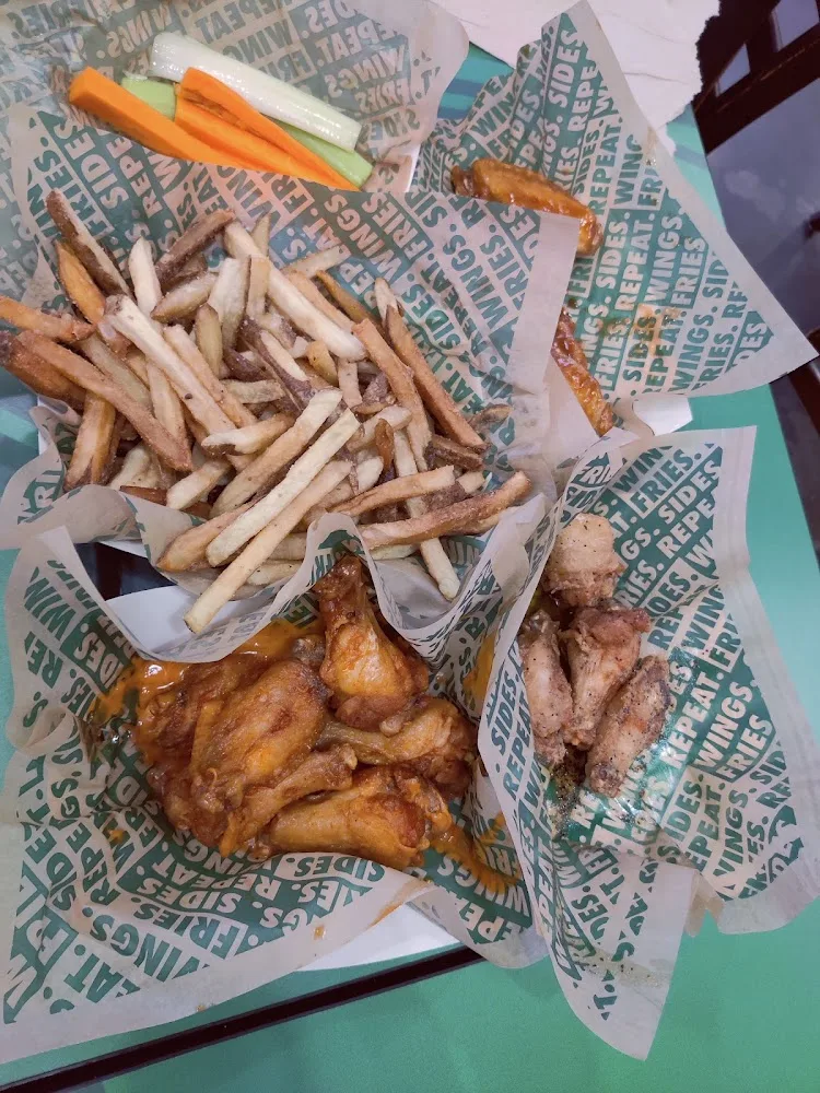 Wingstop food and storefront view at 1401 Highway 100 in Port Isabel, Texas