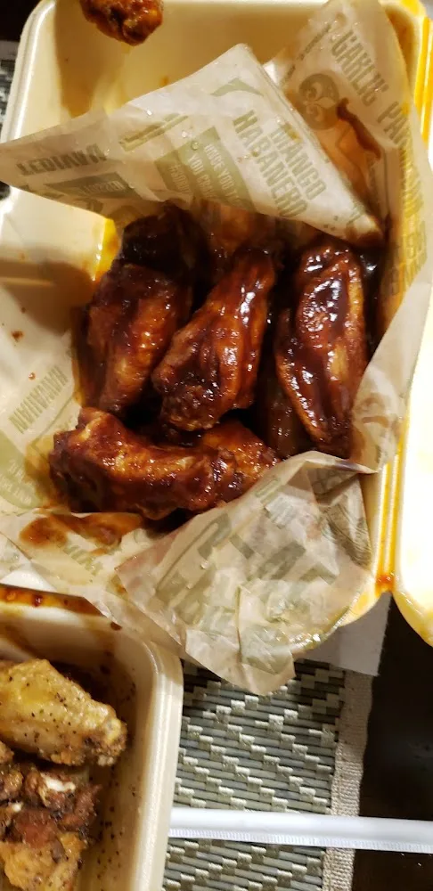 Wingstop food and storefront view at 7039 FM 1464 Ste 210 in Richmond, Texas