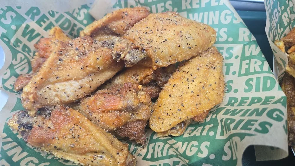 Wingstop food and storefront view at 7035 West Grand Pkwy S in Richmond, Texas