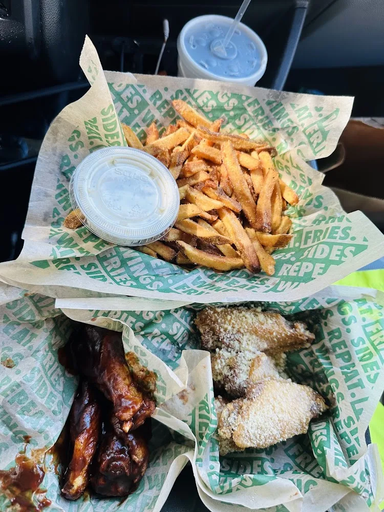 Wingstop food and storefront view at 5601 LIBERTY GROVE RD STE 600 in Rowlett, Texas