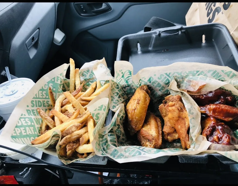Wingstop food and storefront view at 5601 LIBERTY GROVE RD STE 600 in Rowlett, Texas