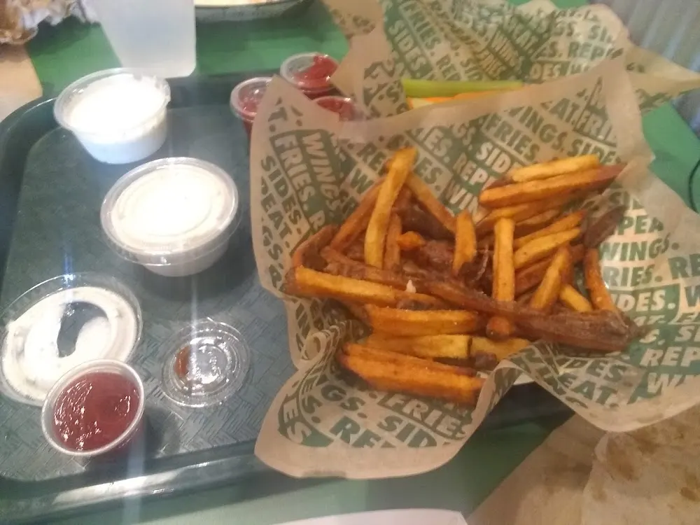 Wingstop food and storefront view at 9234 N Loop 1604 W #101 in San Antonio, Texas