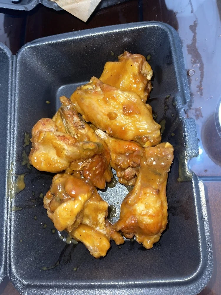 Wingstop food and storefront view at 430 W Loop 1604 N Ste 106 in San Antonio, Texas